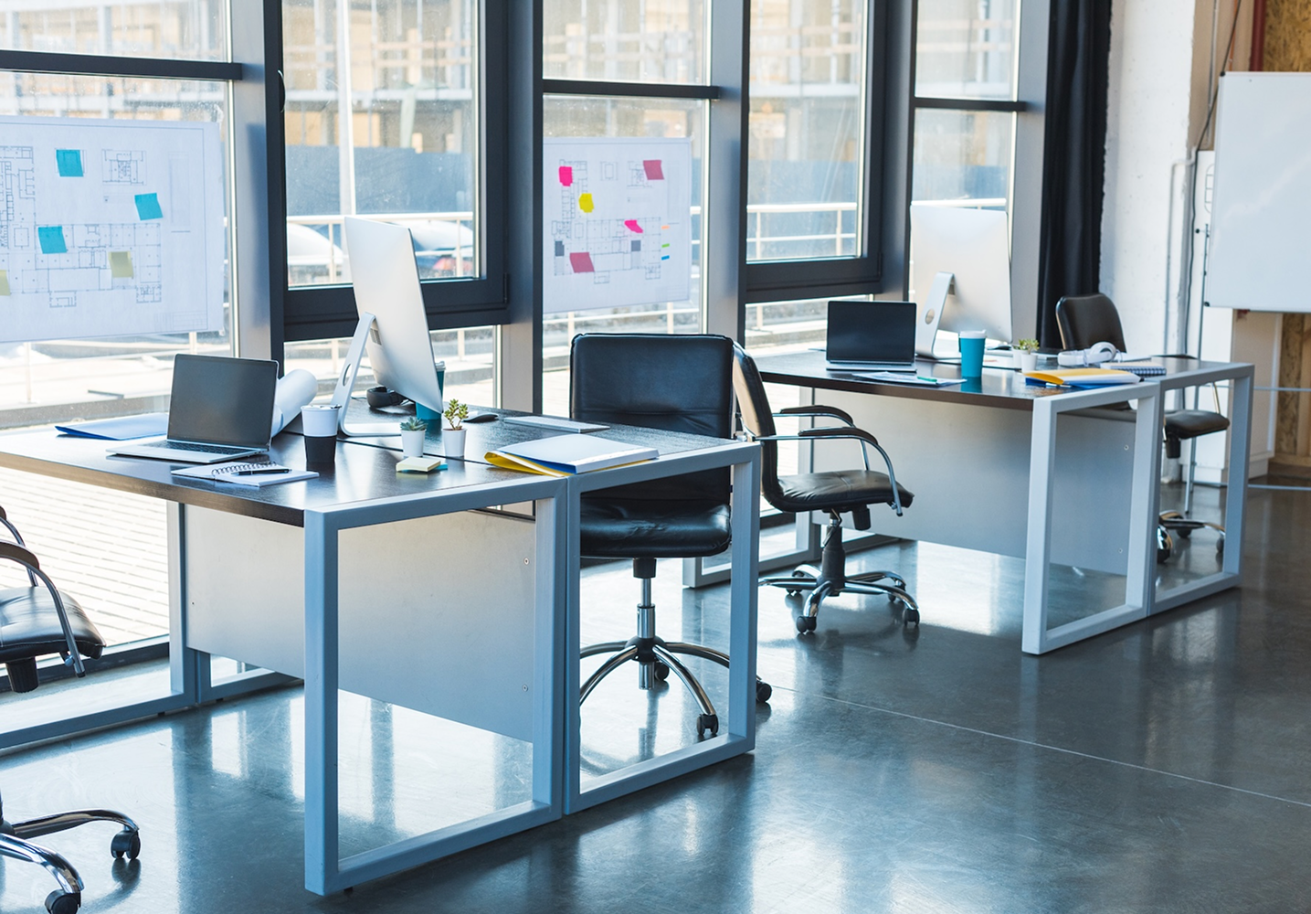 working tables with computers and laptops in busin